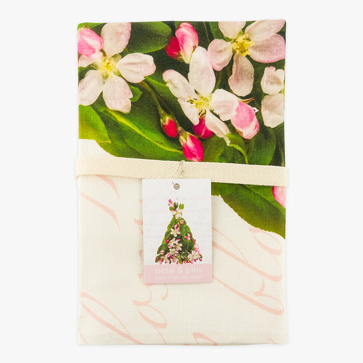 apple blossom pure linen tea towel by petal & pins - folded with cotton twill band and tag