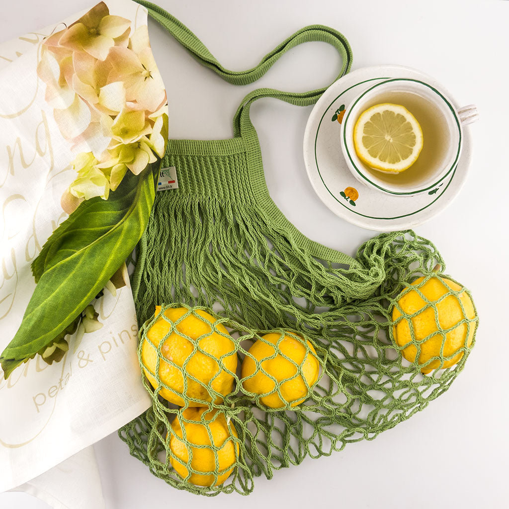 cotton string shopping bag - filt - pergola - styled with petal & pins cream hydrangea tea towel and lemons
