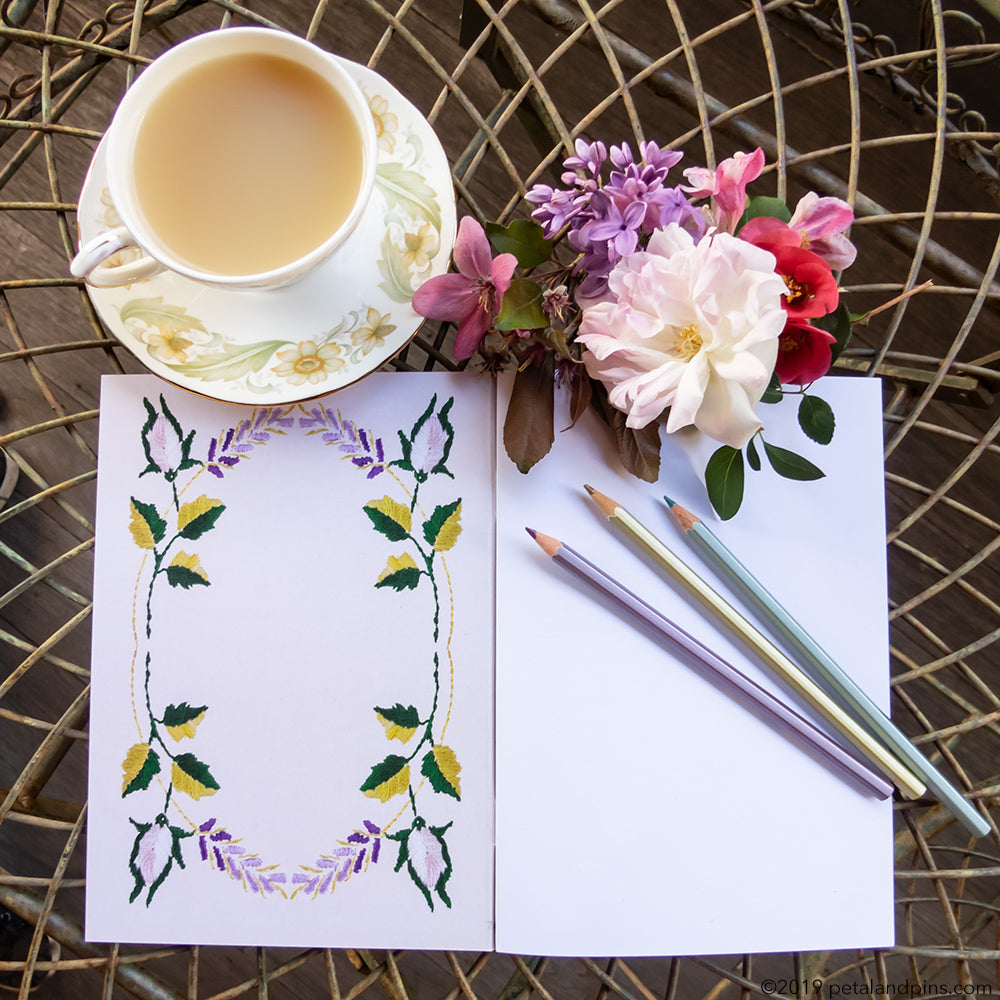 petal & pins notebook with a cup of tea and posy of flowers