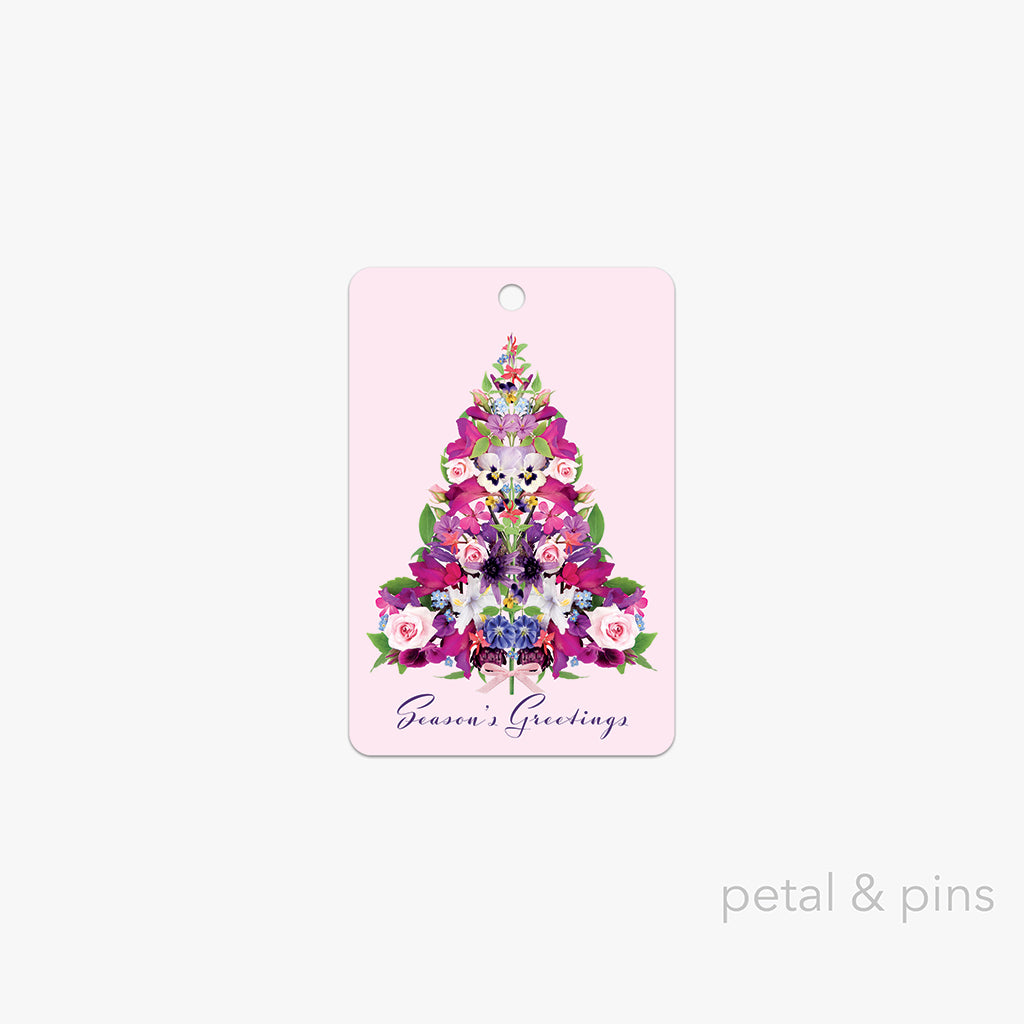 cottage garden Christmas tree gift tag by petal & pins featuring a floral Christmas tree design on a pink background with 'Season's Greetings' text.