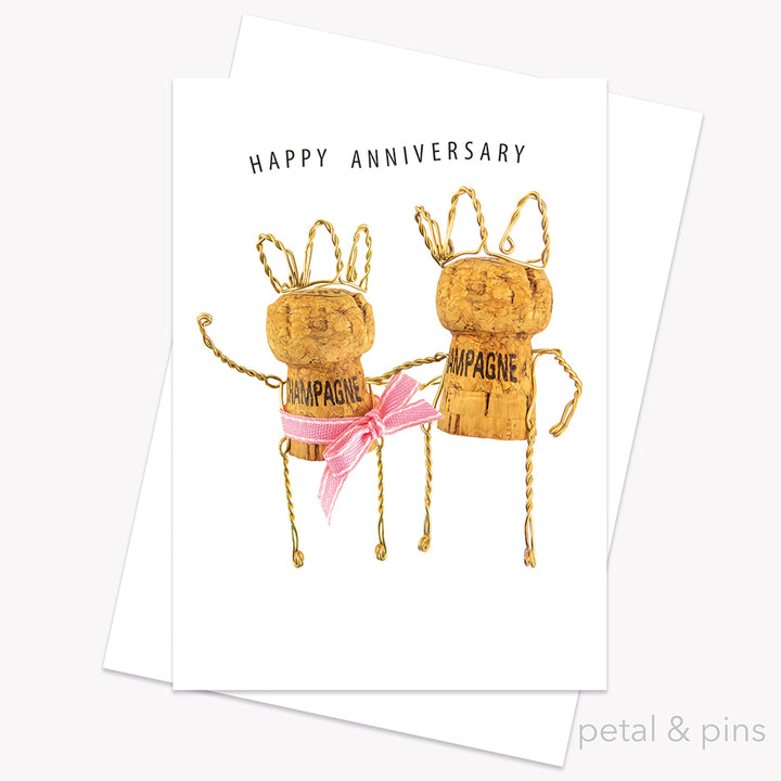 Happy Anniversary Card from the Love Letters collection by petal & pins. Card with two cork characters with the greeting 'Happy Anniversary', on a white background.