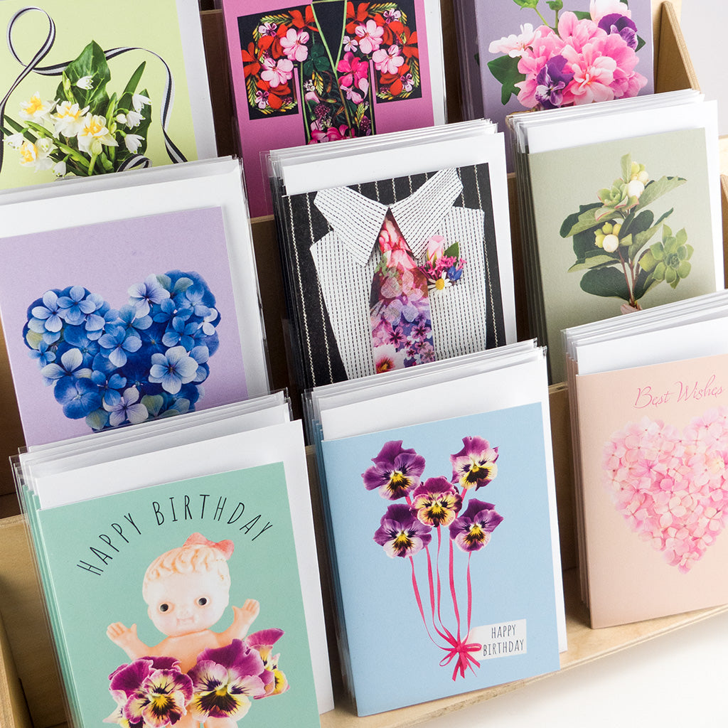 colourful greeting cards from the scrapbook collection by petal & pins styled in stand
