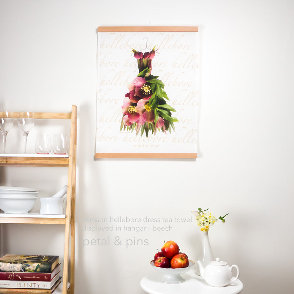 fabric hangar in beech by made from good deeds displayed with crimson hellebore dress tea towel by petal & pins